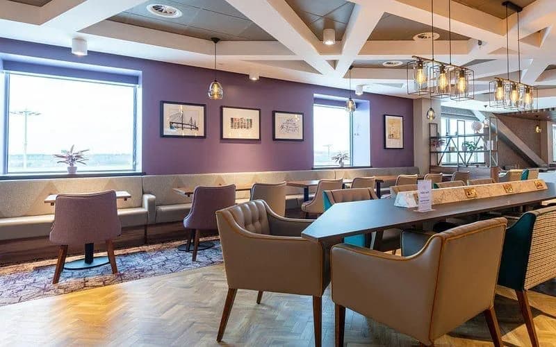 Lounge seating beside the windows at Edinburgh Airport