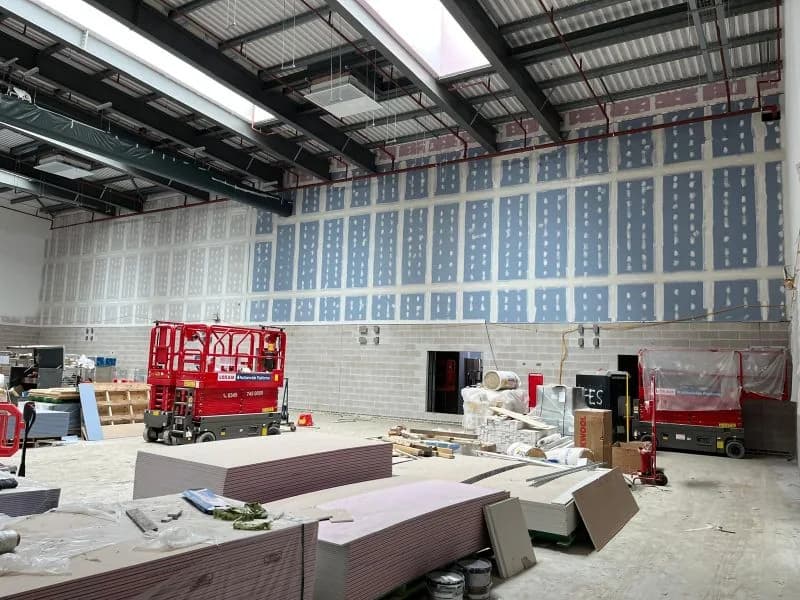 Large hall at Chryston High School with Ames-taped walls and access equipment