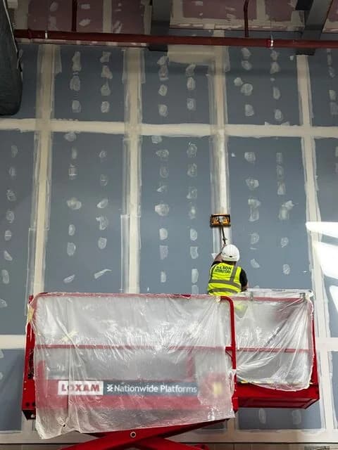 Robert Wilson & Son operative carrying out Ames taping from an access platform
