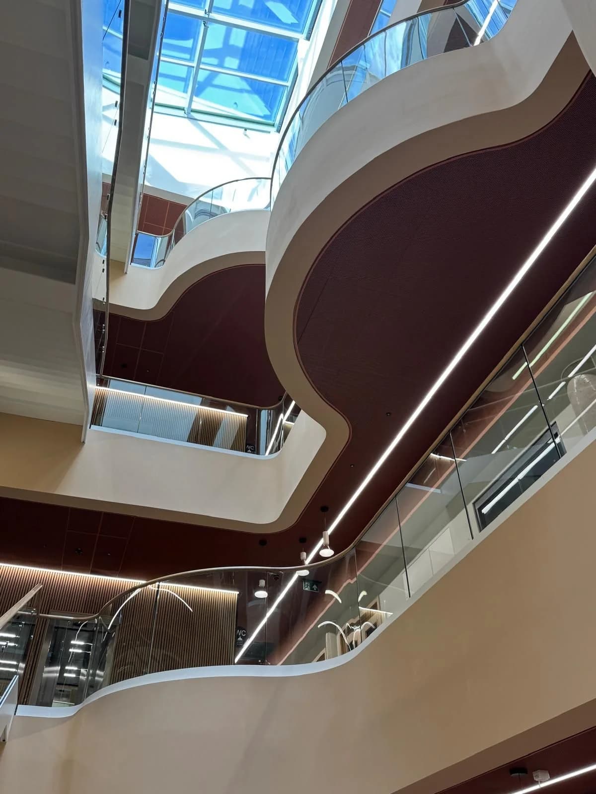Curved atrium balconies and finished ceilings in the Health Innovation Hub